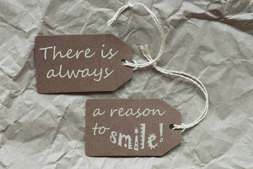 Two Brown Labels With Quote Always Reason Smile Paper Background