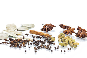 Assorted exotic spices on white background