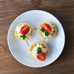 tartlet with cream, tomato and dill