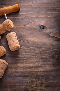 corks of champagne on corkscrew wooden board with copyspace