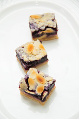 mini fresh blueberry pies on white plate