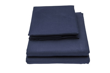 Folded bed linen on white isolated background