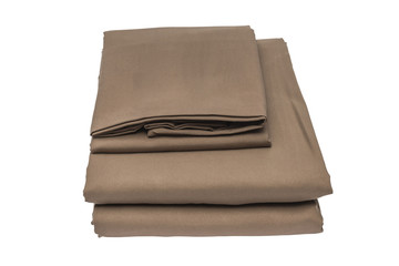 Folded bed linen on white isolated background