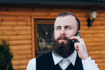 Stylish businessman talking on the phone .