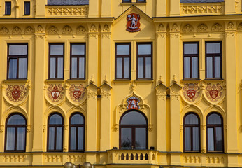 Fototapeta na wymiar heraldic signs on the facade of the house