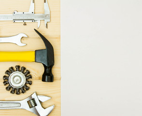 Paper for notes and set of working tools on wooden background.