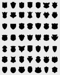 Black silhouettes of shields on white a background, vector