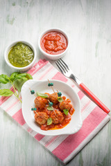 pesto meatballs with tomato sauce