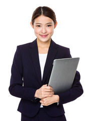 Fototapeta na wymiar Attractive smiling young business woman holding laptop computer