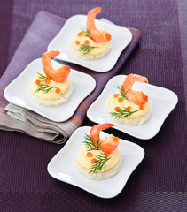 Canapes with shrimp and caviar