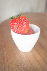 Fresh ripe strawberries on wooden background