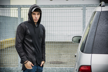 Young man in a winter anorak with hood