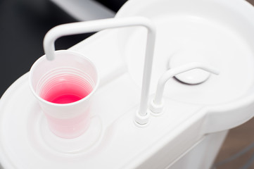Cup of juice in dental clinic