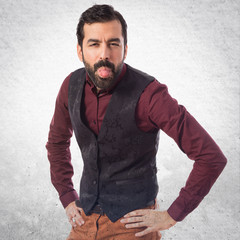 Man wearing waistcoat doing a joke