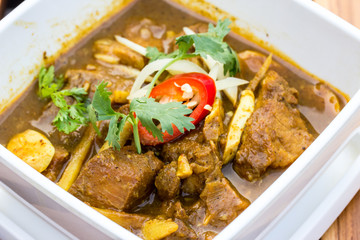 Indian curry lamb rogan josh in a white bowl