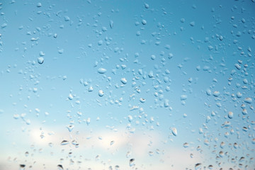 Water drops on a window glass, rainy day