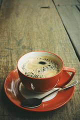 cup of coffee on the wood texture