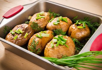 baked potatoes with onion in tray