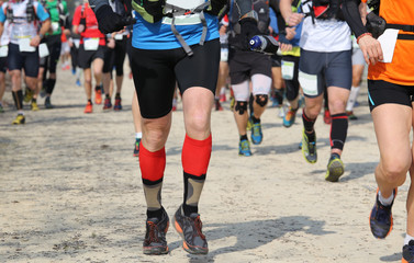 Fototapeta premium runners racing on the road while riding in a race