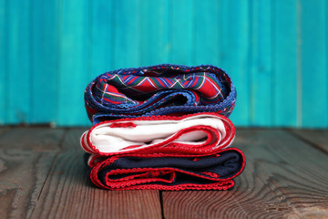 Stack of women's panties lying on a wooden table