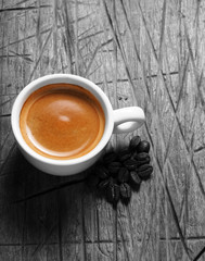 Cup of hot espresso coffee and coffee crop