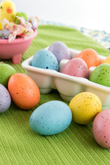 colored Easter eggs, candy and yellow chick