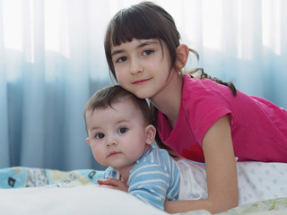 Portrait of caucasian children playing at home