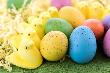 colored Easter eggs and yellow marsshmallow chicks
