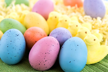 colored Easter eggs and yellow marsshmallow chicks