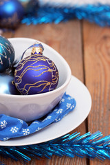 Christmas decorations with balls and white plates