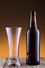 Beer bottle with a glass and spica