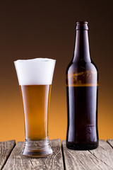 Beer bottle with a glass and spica
