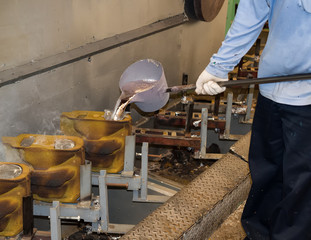 operator pouring aluminum automotive parts