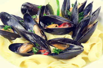 Mussels at white wine sauce on Tagliatelle - vintage style