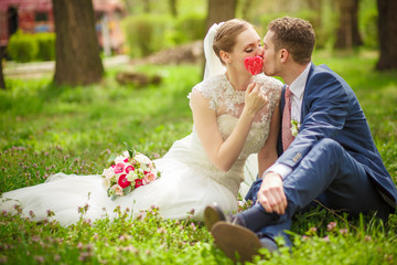 The groom kisses the bride