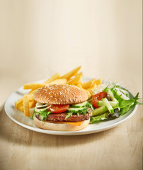 Hamburger with fries and salad