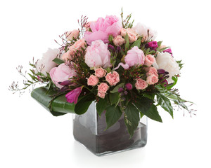 Floral arrangement made of Peony, Roses and Freesia flowers in a
