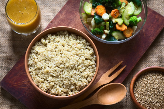 Cooked white quinoa seeds and fried vegetables
