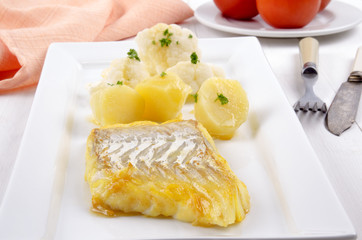 smoked cod with boiled potato and melted butter