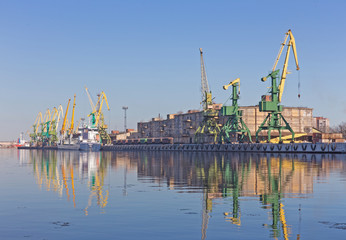 port cranes on the shore