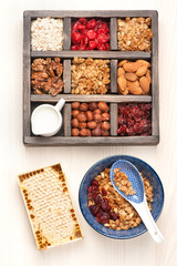 Granola, nuts, oatmeal and honey. Healthy food. Top view.