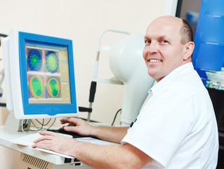 Ophthalmologist or optometrist optician at work