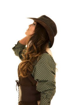 cowgirl in vest and hat look up side