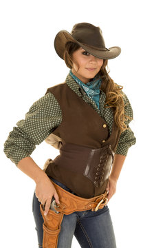 cowgirl with gun and holster ready to draw