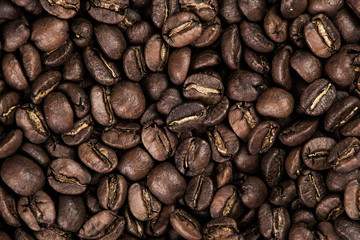 Roasted brown coffee beans, background texture