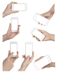 Obraz na płótnie Canvas Hands holding smart phones isolated on white