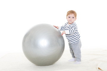 Fototapeta na wymiar Little baby with fitness ball.