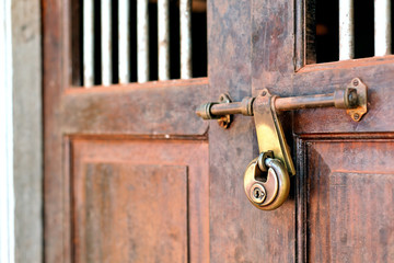Fototapeta premium Closeup of a vintage door with lock