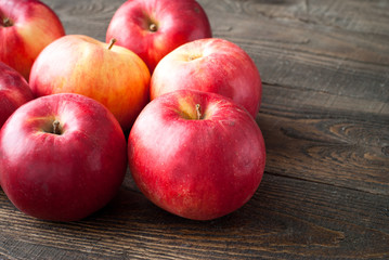 Some red apples at the  table