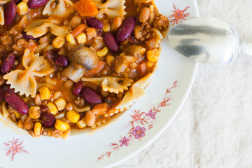 Chili con carne with pasta, top view